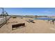 Community lake with picnic tables and benches at 2690 E Abe Truckle Ave, San Tan Valley, AZ 85140