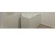 Bright laundry room with a washer and dryer on modern tile flooring at 2690 E Abe Truckle Ave, San Tan Valley, AZ 85140