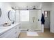 Modern bathroom with walk-in shower and double vanity at 2732 W Lamar Rd, Phoenix, AZ 85017