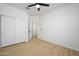 Simple bedroom with light wood floors and a large closet at 2732 W Lamar Rd, Phoenix, AZ 85017