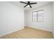 Bright bedroom with ceiling fan and light wood flooring at 2732 W Lamar Rd, Phoenix, AZ 85017