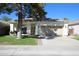 Single-story home with a two-car garage and well-maintained lawn at 2732 W Lamar Rd, Phoenix, AZ 85017