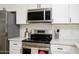 Modern kitchen with stainless steel appliances and white cabinetry at 2732 W Lamar Rd, Phoenix, AZ 85017