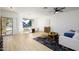 Open living area with hardwood floors, large windows, and modern decor at 2732 W Lamar Rd, Phoenix, AZ 85017