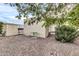 Landscaped backyard with mature trees and gravel at 300 S Val Vista Dr # 152, Mesa, AZ 85204