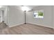 Spacious bedroom with new flooring and large window at 300 S Val Vista Dr # 152, Mesa, AZ 85204