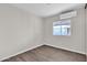 Simple bedroom with window and wood-look flooring at 300 S Val Vista Dr # 152, Mesa, AZ 85204