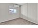 Bright bedroom with window and wood-look flooring at 300 S Val Vista Dr # 152, Mesa, AZ 85204