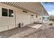 View of the home's exterior showcasing a covered patio at 300 S Val Vista Dr # 152, Mesa, AZ 85204