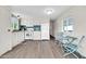 Bright, open kitchen and dining area with light wood flooring at 300 S Val Vista Dr # 152, Mesa, AZ 85204
