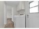 Laundry room with washer, dryer, and extra storage at 300 S Val Vista Dr # 152, Mesa, AZ 85204