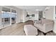 Living room with kitchen view, hardwood floors at 300 S Val Vista Dr # 152, Mesa, AZ 85204