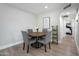 Charming dining area with round wooden table and gray chairs at 3001 N 38Th St # 11, Phoenix, AZ 85018