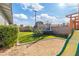 Backyard with trampoline, playset, and fruit tree at 3727 W Orangewood Ave, Phoenix, AZ 85051