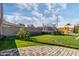 Landscaped backyard with patio and play area at 3727 W Orangewood Ave, Phoenix, AZ 85051