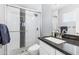 Modern bathroom with a large walk-in shower and dark vanity at 3727 W Orangewood Ave, Phoenix, AZ 85051