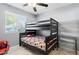 bedroom with a bunk bed and Spiderman decor at 3727 W Orangewood Ave, Phoenix, AZ 85051