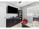 bedroom with large TV, dresser, and Spider-Personal chair at 3727 W Orangewood Ave, Phoenix, AZ 85051