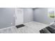 Bright entryway with white door and gray walls at 3727 W Orangewood Ave, Phoenix, AZ 85051