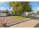 House with mature tree and landscaped yard at 3727 W Orangewood Ave, Phoenix, AZ 85051