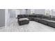 Living room featuring a large gray sectional sofa at 3727 W Orangewood Ave, Phoenix, AZ 85051