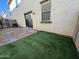 Private backyard with patio and artificial turf at 3865 E Santa Fe Ln, Gilbert, AZ 85297