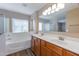 Bathroom with double sinks, soaking tub and a separate shower at 3865 E Santa Fe Ln, Gilbert, AZ 85297