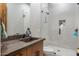 Modern bathroom with a walk-in shower and floating vanity at 39816 N 106Th Pl, Scottsdale, AZ 85262