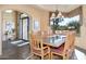 Grand dining room with large wood table and chandelier at 39816 N 106Th Pl, Scottsdale, AZ 85262