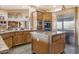 Large kitchen with island, granite countertops, and stainless steel appliances at 39816 N 106Th Pl, Scottsdale, AZ 85262