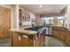 Kitchen features granite countertops, stainless steel appliances, and custom cabinetry at 39816 N 106Th Pl, Scottsdale, AZ 85262