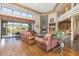 Open concept living room with a fireplace, built-in bar, and stunning mountain views at 39816 N 106Th Pl, Scottsdale, AZ 85262