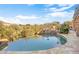 Inviting kidney-shaped pool with a waterfall feature and mountain views at 39816 N 106Th Pl, Scottsdale, AZ 85262