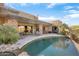 Luxury backyard oasis featuring a large pool, spacious patio, and stunning mountain views at 39816 N 106Th Pl, Scottsdale, AZ 85262