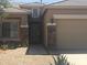 House entrance with stone accents and a double door entry at 45091 W Gavilan Dr, Maricopa, AZ 85139