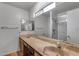 Bathroom boasts double vanity and walk-in shower at 4556 N 88Th Ave, Phoenix, AZ 85037