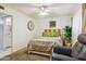 Main bedroom with a king-size bed and a recliner at 4801 W Marlette Ave, Glendale, AZ 85301