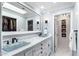 Elegant bathroom with dual vanity sinks, marble countertops, and a large mirror at 5758 N 25Th St, Phoenix, AZ 85016