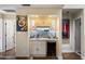 Convenient wet bar with wine cooler, cabinets, and a herringbone backsplash at 5758 N 25Th St, Phoenix, AZ 85016