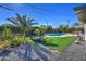 Landscaped backyard with pool and fire pit at 8349 E Columbus Ave, Scottsdale, AZ 85251