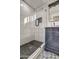 Modern bathroom with a walk-in shower, stylish vanity, and patterned tile floor at 8349 E Columbus Ave, Scottsdale, AZ 85251