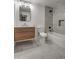 Modern bathroom with floating vanity, bathtub, and updated fixtures at 8349 E Columbus Ave, Scottsdale, AZ 85251