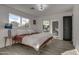 Main bedroom with wood bed frame and access to backyard at 8349 E Columbus Ave, Scottsdale, AZ 85251