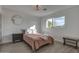 Bright bedroom with a queen bed, window, and wood-look flooring at 8349 E Columbus Ave, Scottsdale, AZ 85251