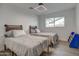 Bedroom with two twin beds and blue bookshelf at 8349 E Columbus Ave, Scottsdale, AZ 85251