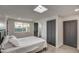 Bright bedroom with plush bed, window, and built-in closet at 8349 E Columbus Ave, Scottsdale, AZ 85251