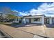 Updated mid-century modern home with carport and landscaped front yard at 8349 E Columbus Ave, Scottsdale, AZ 85251