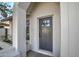 Front entrance with a gray door and white columns at 8349 E Columbus Ave, Scottsdale, AZ 85251