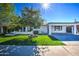 Modern home with attached carport and well-manicured lawn at 8349 E Columbus Ave, Scottsdale, AZ 85251