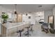 Open kitchen features a breakfast bar, light wood cabinets, and a view into the bedroom at 8349 E Columbus Ave, Scottsdale, AZ 85251
